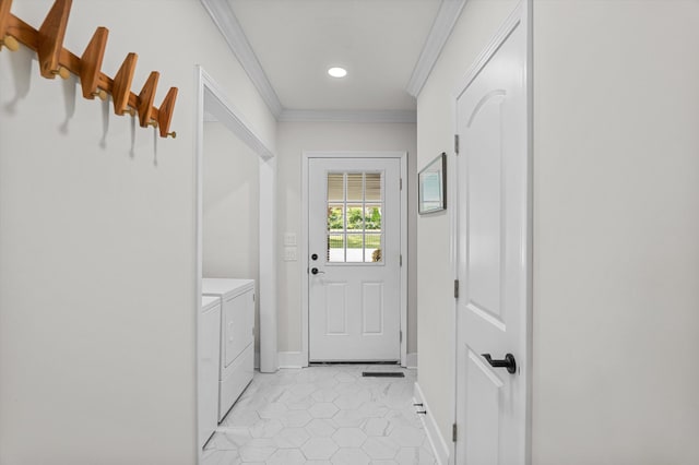 entryway featuring crown molding, separate washer and dryer, baseboards, and light tile patterned floors