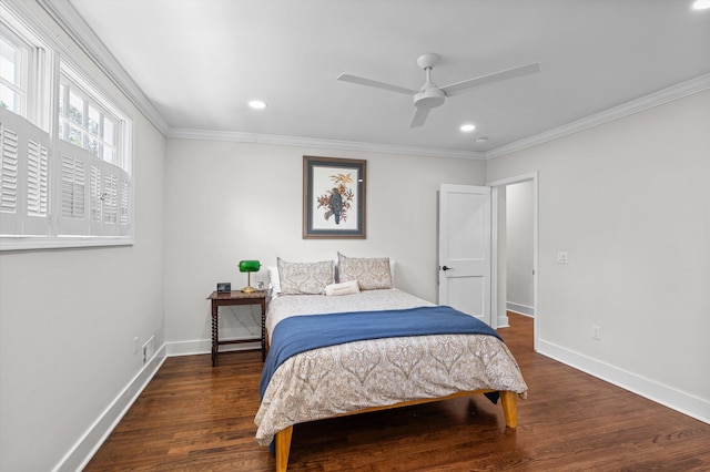 bedroom with baseboards, ornamental molding, and wood finished floors