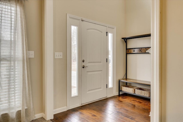 entryway with plenty of natural light and dark hardwood / wood-style floors