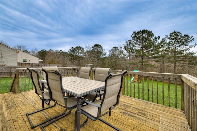 wooden terrace with a yard