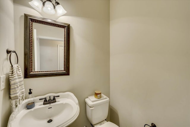 bathroom with toilet and sink