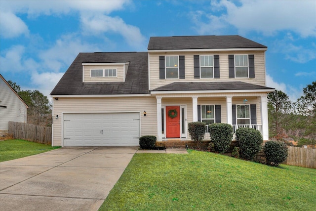 view of front of property with covered porch, a front lawn, and a garage