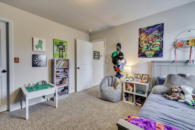 bedroom with a textured ceiling and carpet