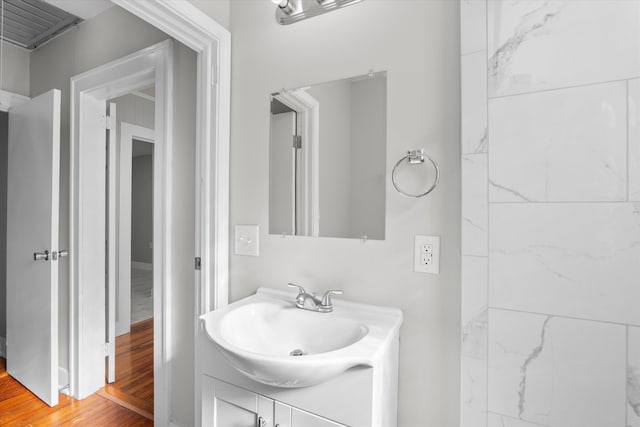 bathroom featuring hardwood / wood-style floors and vanity