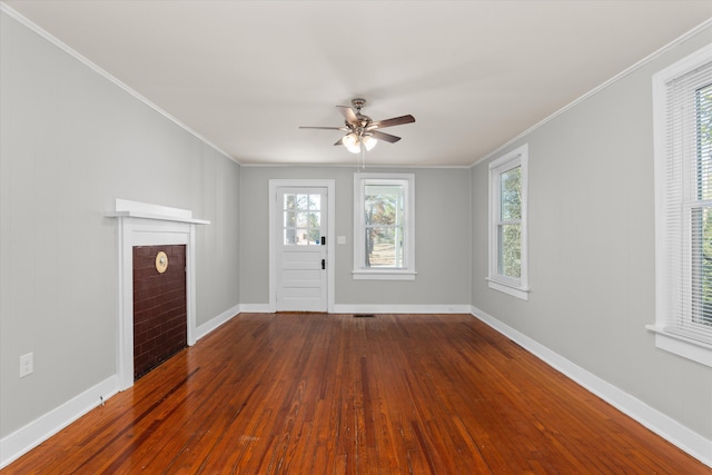 entrance foyer featuring dark hardwood / wood-style floors, ceiling fan, and crown molding