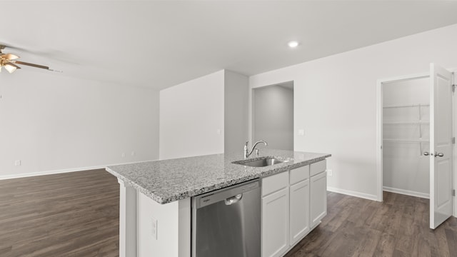 kitchen with dark wood-type flooring, white cabinetry, a ceiling fan, dishwasher, and a sink