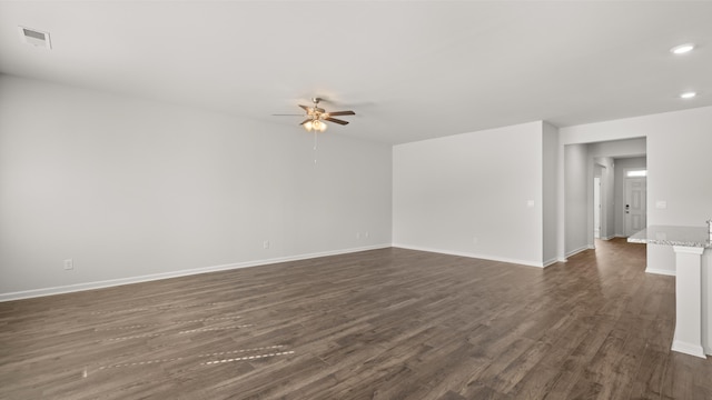 empty room with visible vents, baseboards, a ceiling fan, dark wood finished floors, and recessed lighting