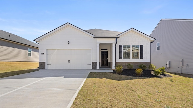 single story home featuring an attached garage, driveway, and a front lawn