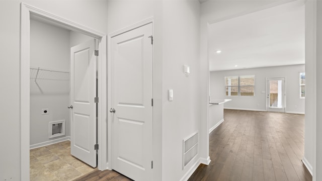 hall featuring recessed lighting, hardwood / wood-style flooring, visible vents, and baseboards