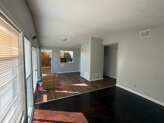 3314 Forest Estates Dr, Augusta, GA 30909 - unfurnished room with wood finished floors, baseboards, and vaulted ceiling