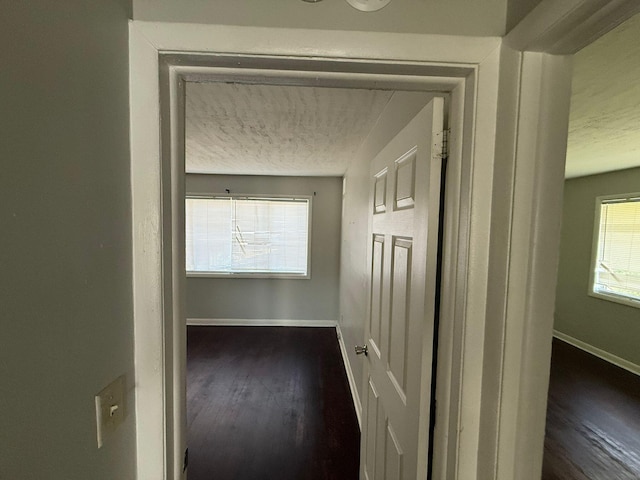 3314 Forest Estates Dr, Augusta, GA 30909 - hall featuring a textured ceiling, baseboards, and dark wood finished floors