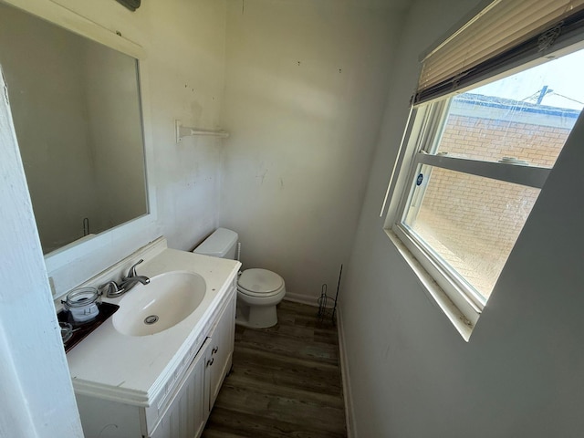 3314 Forest Estates Dr, Augusta, GA 30909 - bathroom with toilet, wood finished floors, vanity, and baseboards