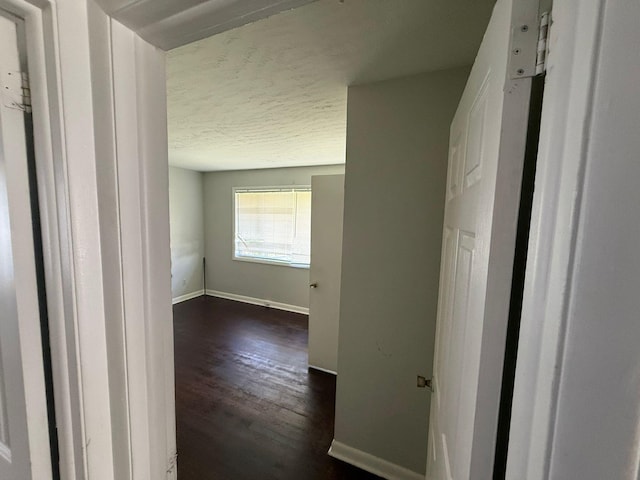 3314 Forest Estates Dr, Augusta, GA 30909 - hall featuring dark wood-style floors, baseboards, and a textured ceiling