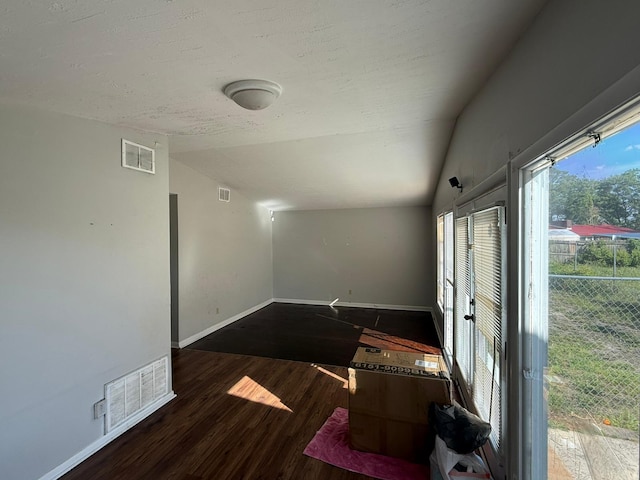 3314 Forest Estates Dr, Augusta, GA 30909 - spare room featuring vaulted ceiling, baseboards, wood finished floors, and a textured ceiling