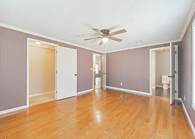 5850 Jaime Dr, Grovetown, GA 30813 - unfurnished bedroom with crown molding, light wood-style floors, and a ceiling fan