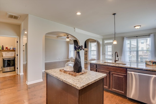 336 Shell Brooke Way, Lexington, SC 29073 - kitchen featuring dishwasher, a sink, arched walkways, a center island, and ornamental molding