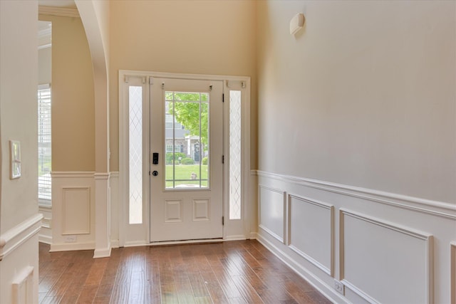 336 Shell Brooke Way, Lexington, SC 29073 - foyer entrance with a decorative wall, arched walkways, a wainscoted wall, and wood-type flooring