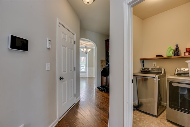 336 Shell Brooke Way, Lexington, SC 29073 - laundry room with washing machine and dryer, a chandelier, arched walkways, light wood-type flooring, and baseboards