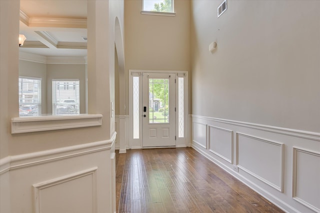336 Shell Brooke Way, Lexington, SC 29073 - entrance foyer featuring ornamental molding, beamed ceiling, wood-type flooring, arched walkways, and a wainscoted wall