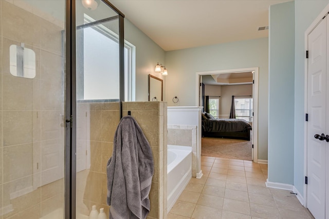 336 Shell Brooke Way, Lexington, SC 29073 - bathroom with tile patterned floors, ensuite bath, a bath, a shower stall, and baseboards