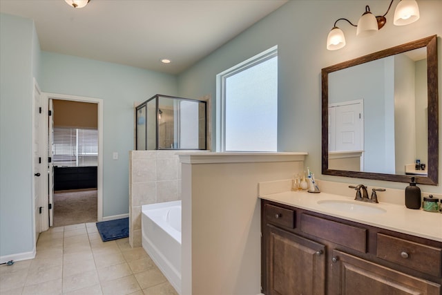 336 Shell Brooke Way, Lexington, SC 29073 - full bathroom featuring a stall shower, vanity, a bath, tile patterned flooring, and baseboards