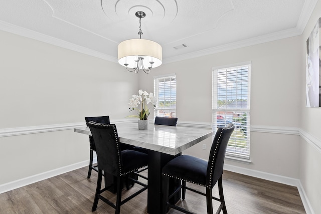 3235 Warwick Pl, Hephzibah, GA 30815 - dining area with a chandelier, dark wood-type flooring, and crown molding
