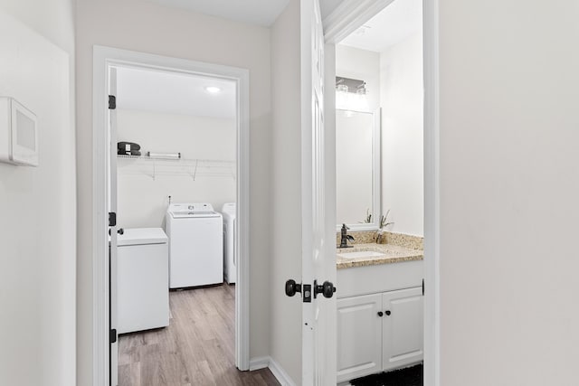 3235 Warwick Pl, Hephzibah, GA 30815 - washroom featuring separate washer and dryer and light wood-style floors