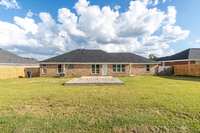 3235 Warwick Pl, Hephzibah, GA 30815 - back of house featuring a fenced backyard, brick siding, and a deck