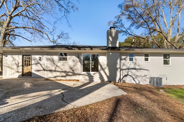 rear view of house featuring central AC and a patio