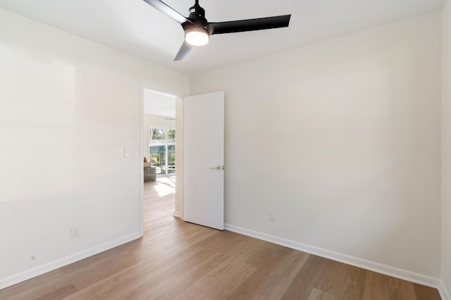 empty room featuring ceiling fan and light wood-type flooring