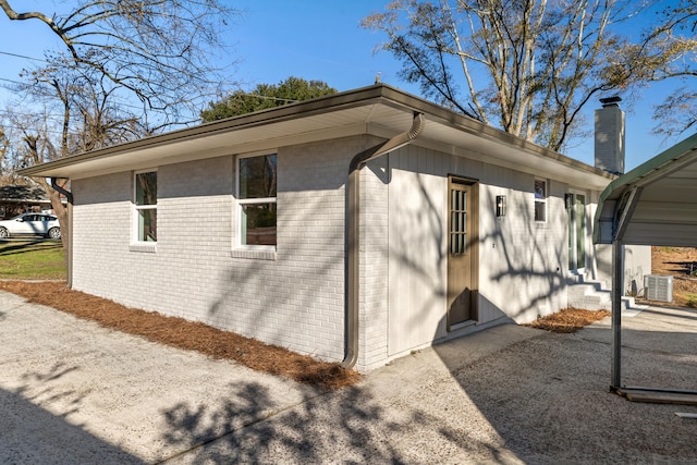 view of side of property with central AC unit