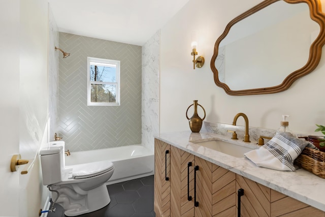 full bathroom featuring tile patterned flooring, vanity, toilet, and tiled shower / bath combo