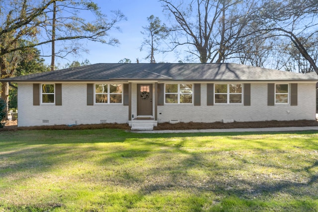 ranch-style home with a front yard