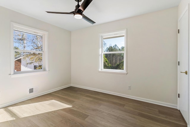 unfurnished room with hardwood / wood-style flooring and ceiling fan