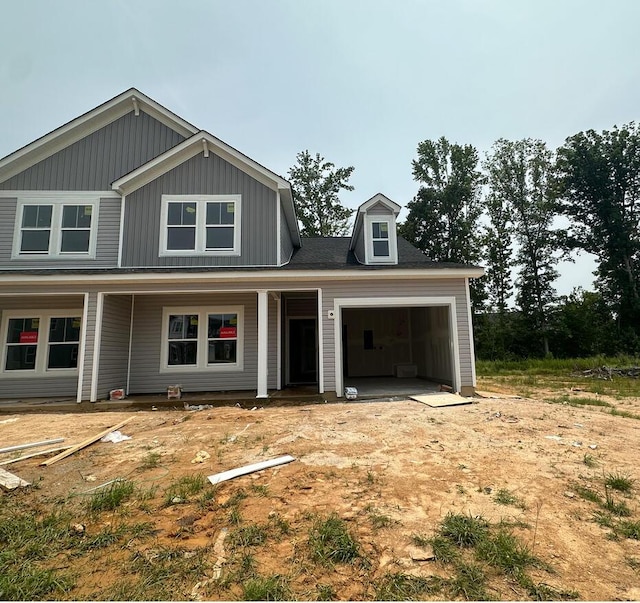 1143 Clareton Dr, Grovetown, GA 30813 - view of front of house featuring an attached garage, board and batten siding, and a porch