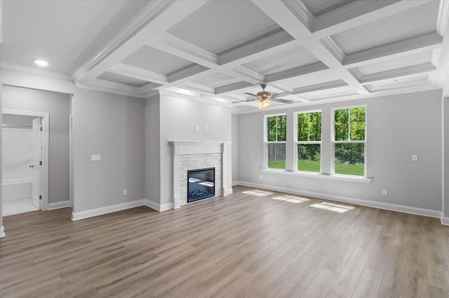 823 Elsie Dr, North Augusta, SC 29860 - unfurnished living room featuring ceiling fan, a glass covered fireplace, wood finished floors, beam ceiling, and coffered ceiling