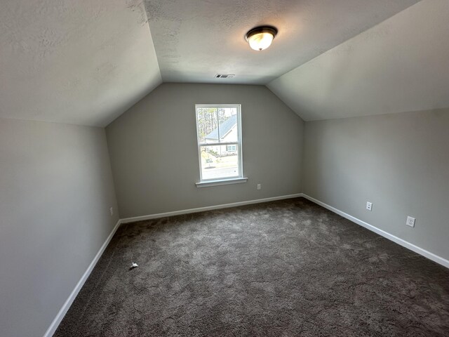 bathroom with concrete floors, shower / tub combination, and baseboards