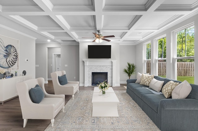 823 Elsie Dr, North Augusta, SC 29860 - living area featuring wood finished floors, ceiling fan, coffered ceiling, beamed ceiling, and a tile fireplace