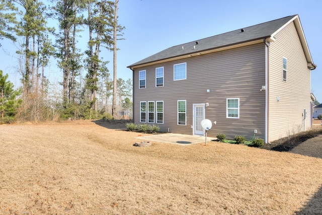 rear view of property featuring a patio