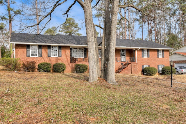 ranch-style house with a front lawn