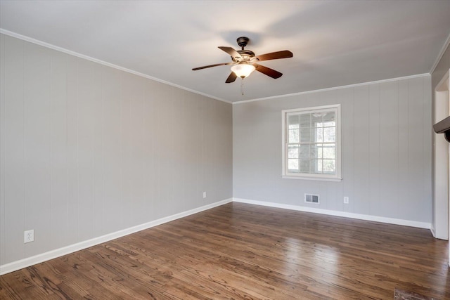 spare room with dark hardwood / wood-style flooring, ceiling fan, and crown molding