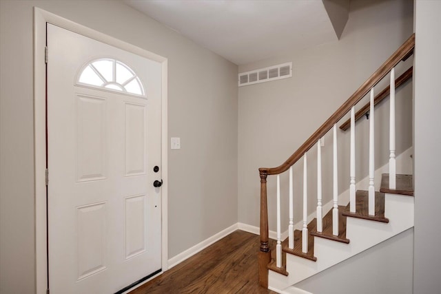 foyer entrance with dark hardwood / wood-style flooring