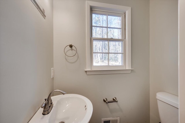 bathroom with toilet and sink