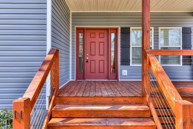 entrance to property featuring covered porch