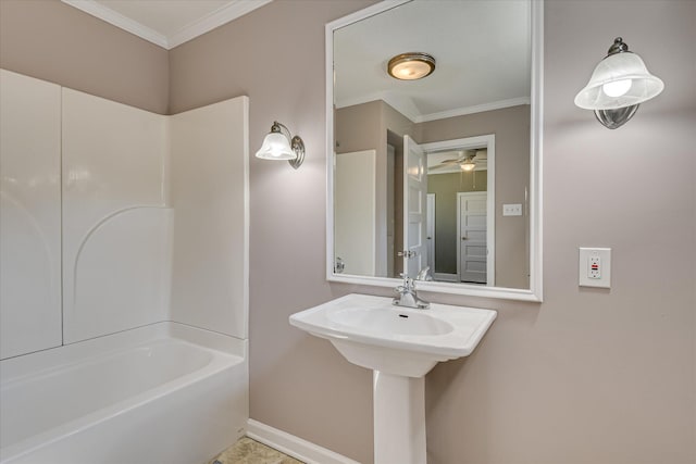 bathroom with ceiling fan, baseboards, ornamental molding, and washtub / shower combination