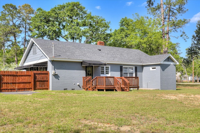 back of house with a chimney, fence, crawl space, a lawn, and a deck