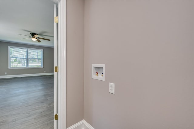 clothes washing area featuring ceiling fan, wood finished floors, baseboards, and washer hookup