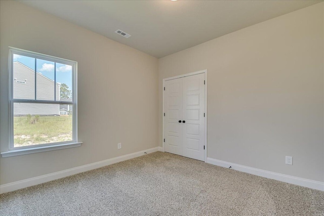 view of carpeted spare room