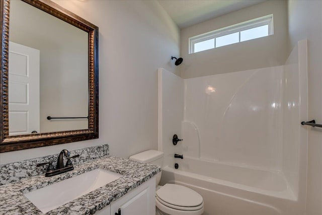 full bathroom featuring shower / bathtub combination, vanity, and toilet