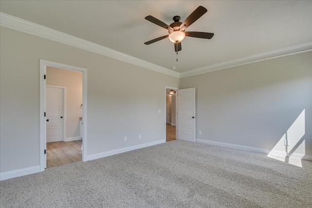 unfurnished room featuring ornamental molding, light carpet, and ceiling fan